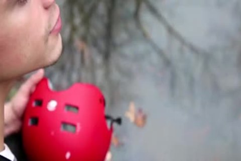 Dean Monroe wearing latex rimming outdoors