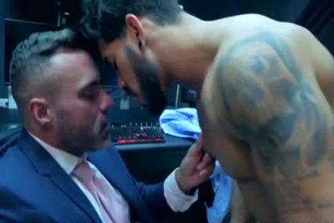 Pietro Duarte in a suit enjoying big cock hunk Manuel Skye